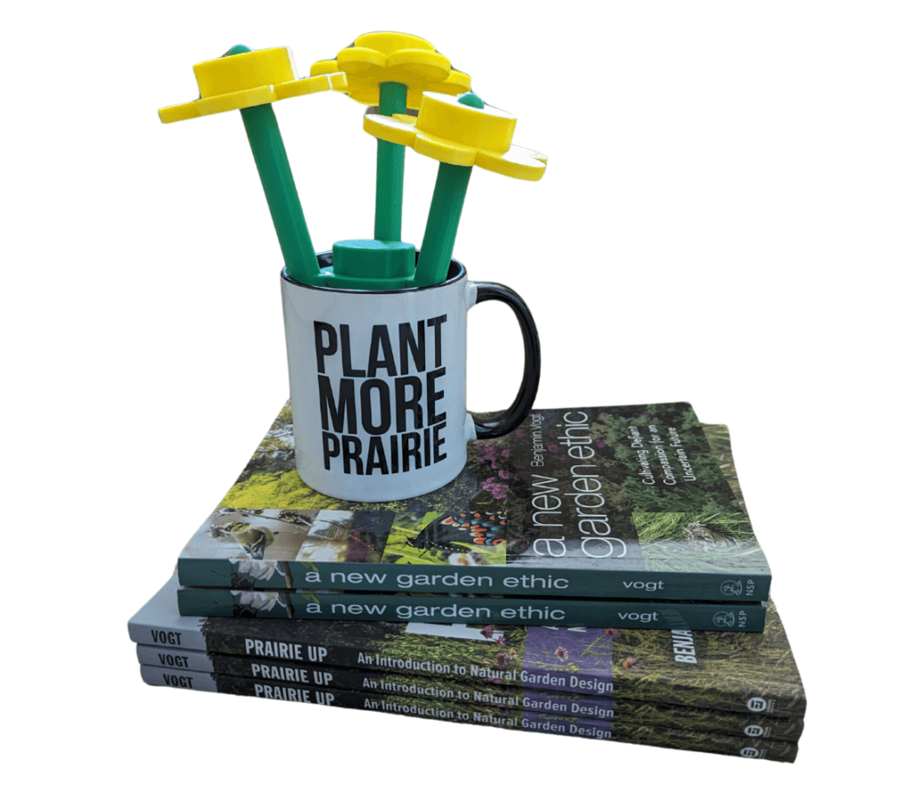 Plant more prairie mug sits atop a stack of books authored by Benjamin Vogt, including A new garden ethic cultivating defiant compassion for an uncertain future as well as Prairie up an introduction to natural garden design.